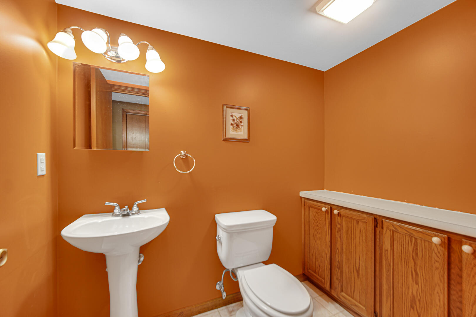 700 Meadow Lane Crown Point, IN 46307 - Photo 24 of 28 a bathroom with a toilet a sink and mirror