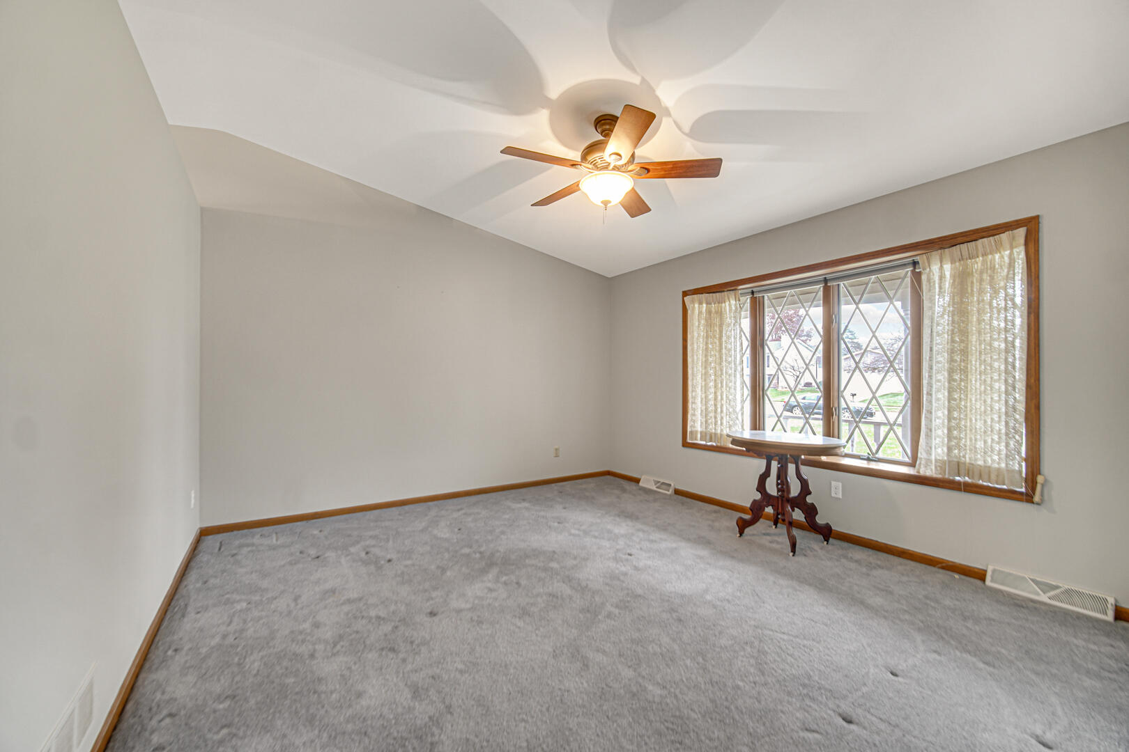 700 Meadow Lane Crown Point, IN 46307 - Photo 5 of 28 an empty room with windows and fan