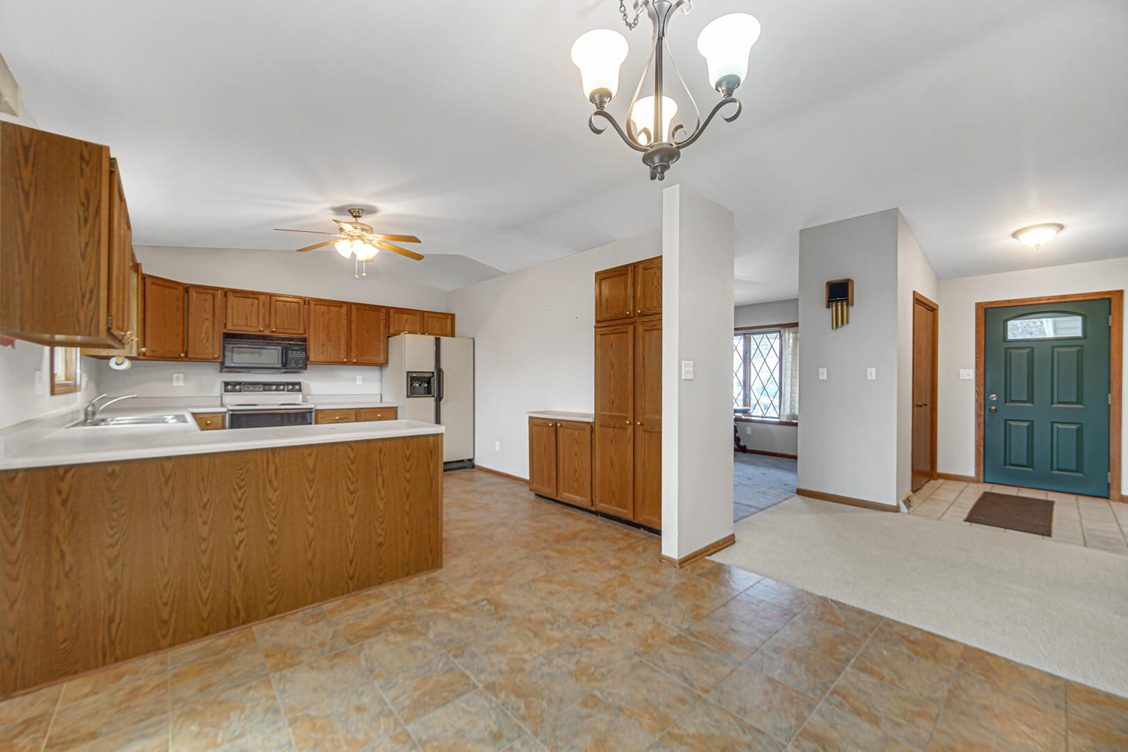 700 Meadow Lane Crown Point, IN 46307 - Photo 9 of 28 a view of kitchen with stainless steel appliances granite countertop living room