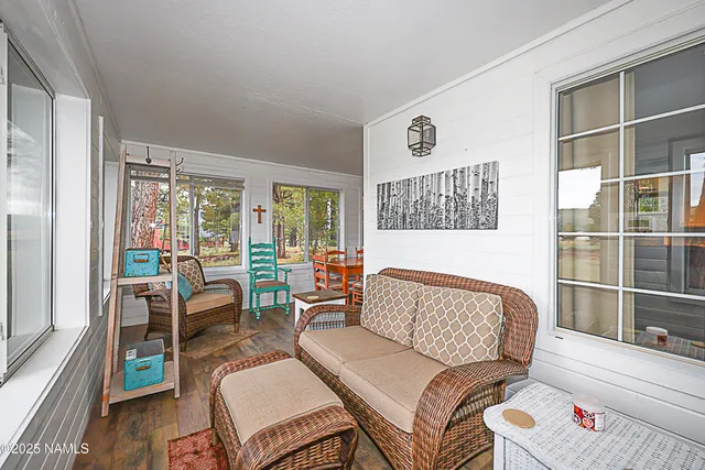 a bathroom with a toilet and a shower curtain