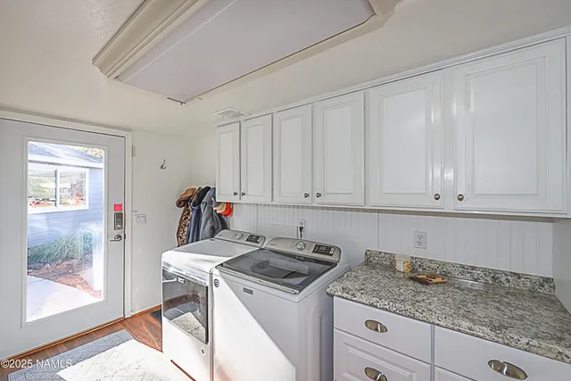 a spacious bedroom with a bed and a couch