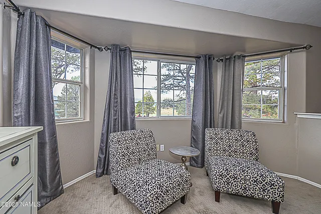 a view of parking garage with cars