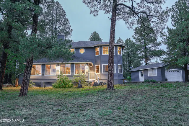 a outdoor kitchen with stainless steel appliances granite countertop a sink and cabinets