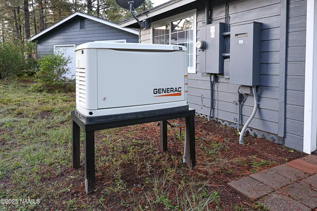 a view of a house with a yard and sitting area