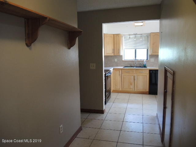 6990 Boston Road Cocoa, FL 32927 - Photo 12 of 26 a bathroom with a granite countertop sink and mirror