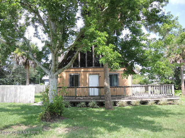 6990 Boston Road Cocoa, FL 32927 - Photo 26 of 26 a white house that has garden in front of it