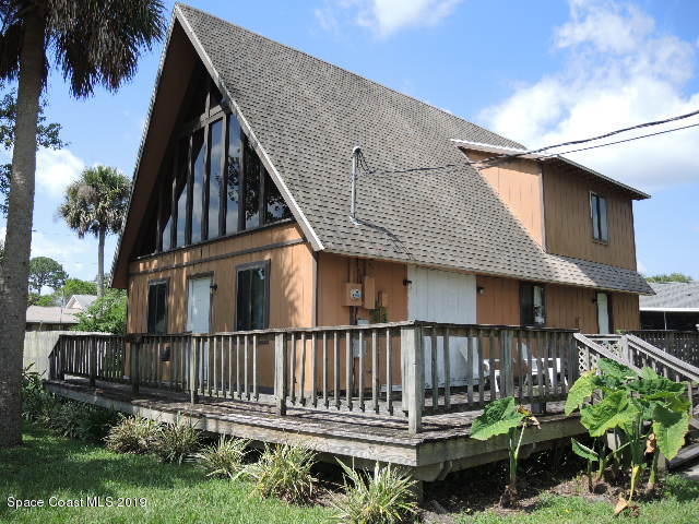 6990 Boston Road Cocoa, FL 32927 - Photo 6 of 26 a view of a house with wooden deck and furniture