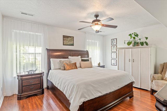 246 West Mount Charm Road Toquerville, UT 84774 - Photo 25 of 70 Bedroom featuring a textured ceiling, dark wood finished floors, and ceiling fan