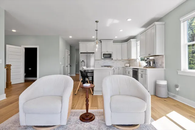 a bedroom with bed and wooden floor