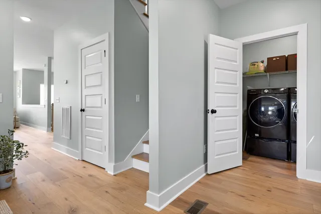 a dining room with furniture and wooden floor