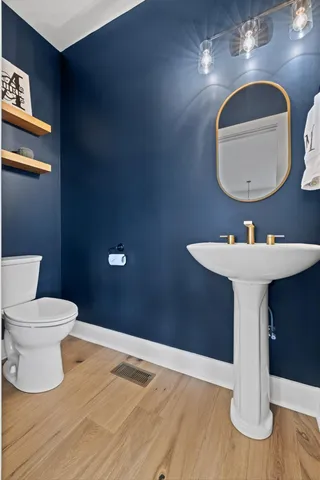 a en suite bathroom with a double vanity sink a mirror and a shower