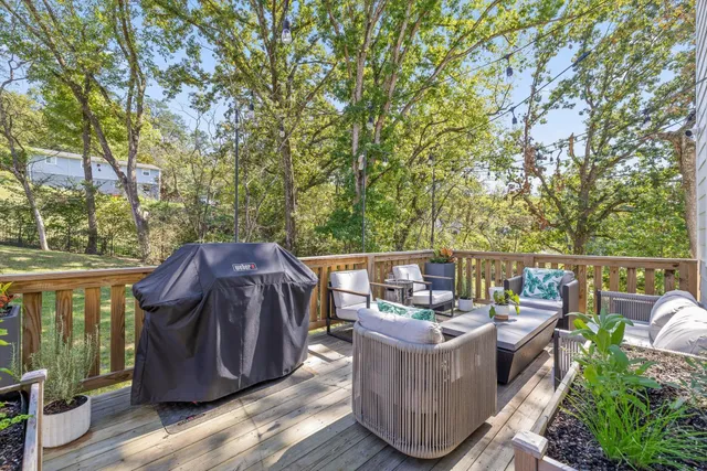 a view of a houses with a lush green hillside