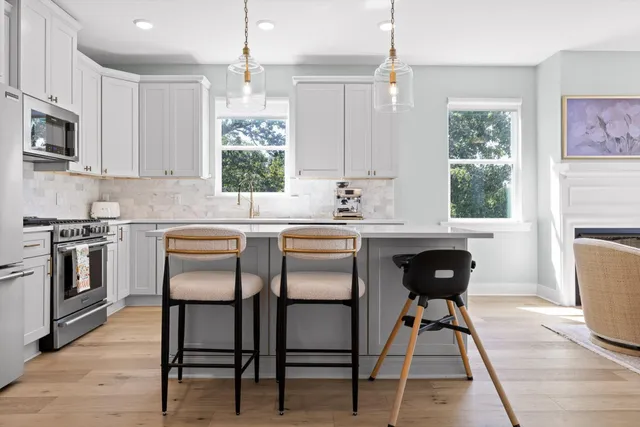 a spacious en suite bathroom with a double vanity sink and a mirror