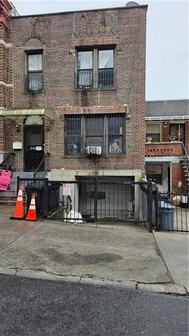 a view of front of a building with many windows