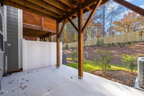 a view of a backyard with a large tree