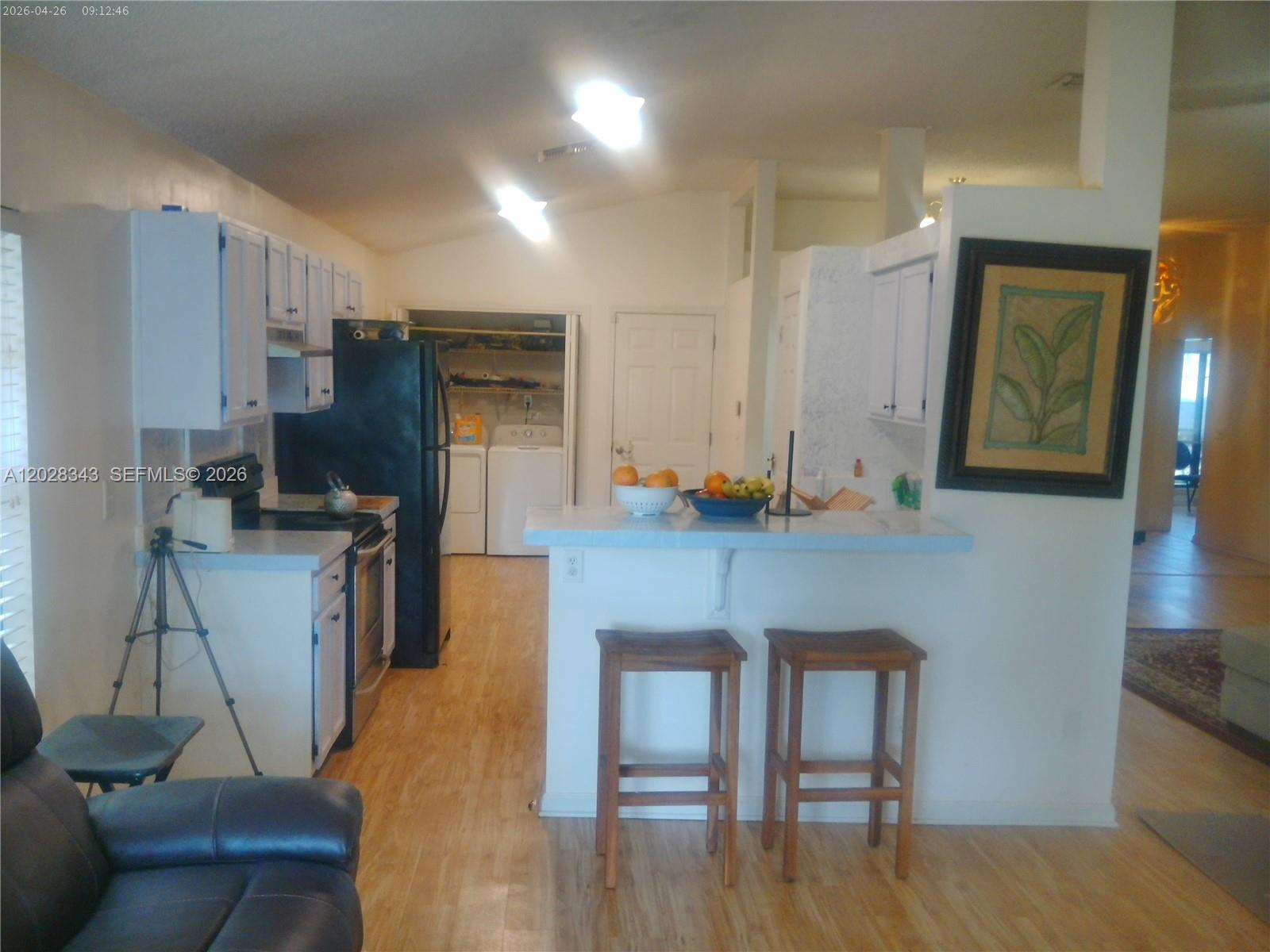 1641 Spring Oaks Lane Jacksonville, FL 32221 - Photo 33 of 44 a kitchen with a table chairs refrigerator and sink