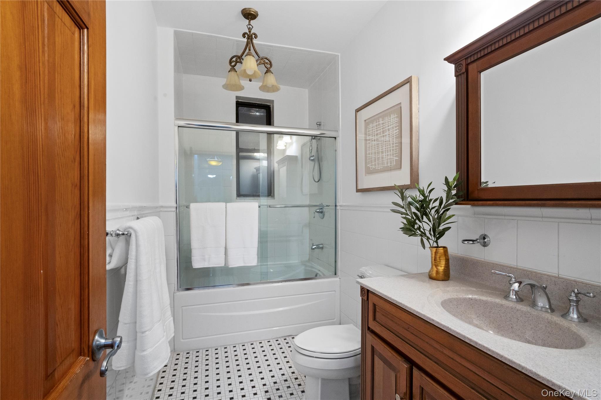110-21 73rd Road, Unit 5H Queens, NY 11375 - Photo 12 of 14 a bathroom with a granite countertop sink toilet and shower