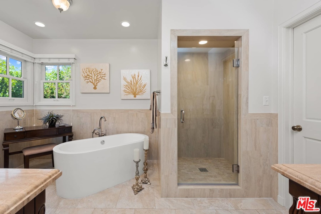 1020 Casiano Road Los Angeles, CA 90049 - Photo 12 of 31 a bathroom with a sink a toilet and shower