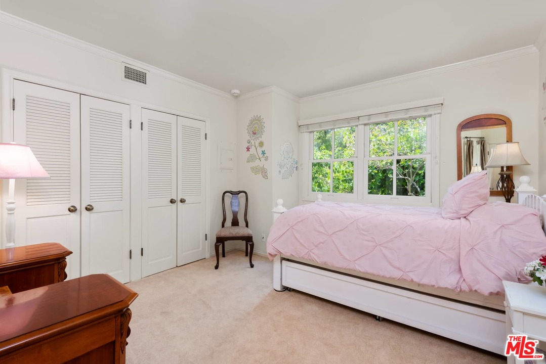 1020 Casiano Road Los Angeles, CA 90049 - Photo 15 of 31 a bedroom with a bed and a couch