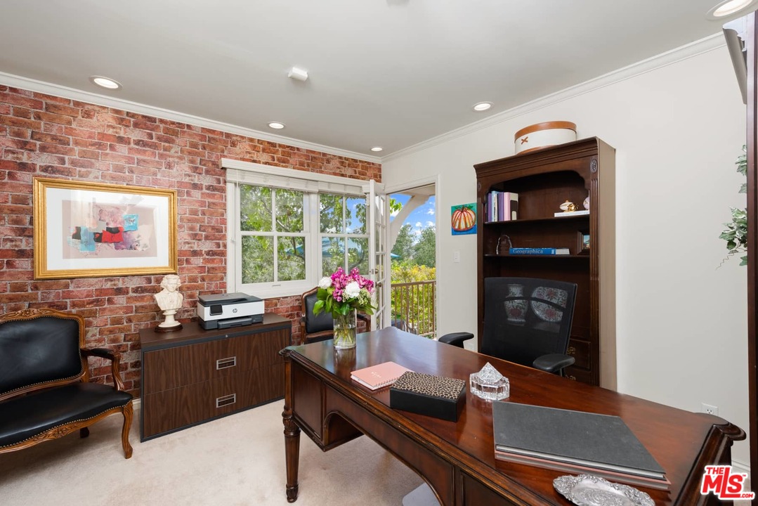 1020 Casiano Road Los Angeles, CA 90049 - Photo 16 of 31 a room with furniture and a potted plant