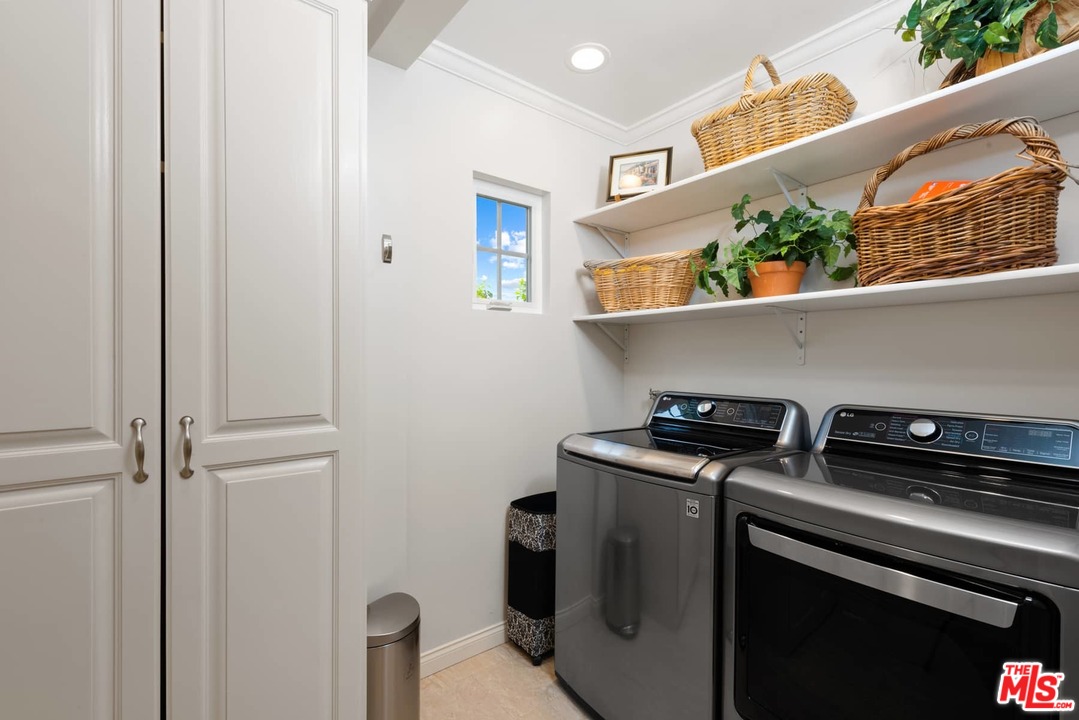 1020 Casiano Road Los Angeles, CA 90049 - Photo 18 of 31 a utility room with dryer and washer