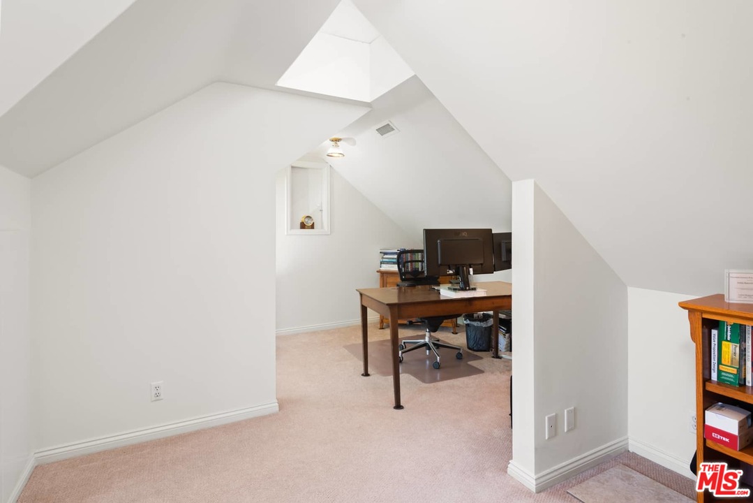 1020 Casiano Road Los Angeles, CA 90049 - Photo 24 of 31 a view of a workspace with furniture and a window