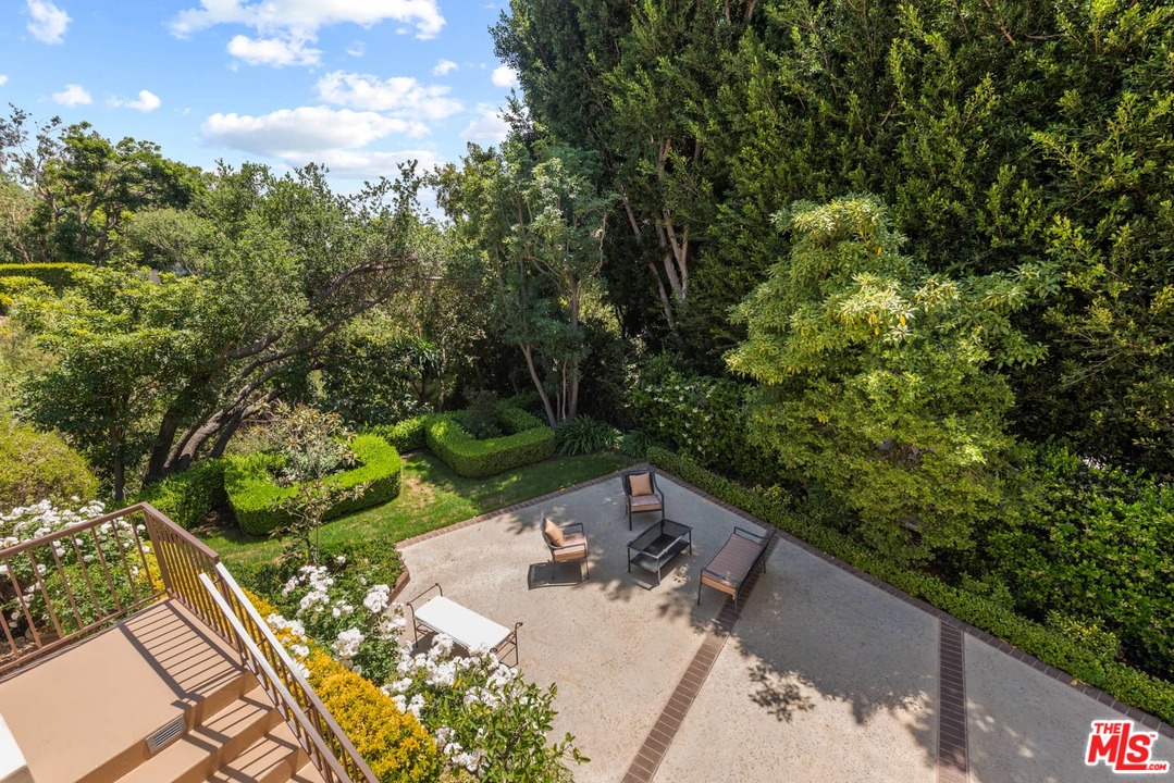1020 Casiano Road Los Angeles, CA 90049 - Photo 25 of 31 a view of a backyard with couches and a table
