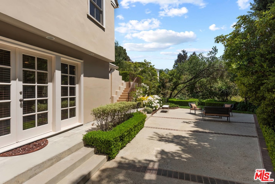 1020 Casiano Road Los Angeles, CA 90049 - Photo 27 of 31 a view of a house with a garden