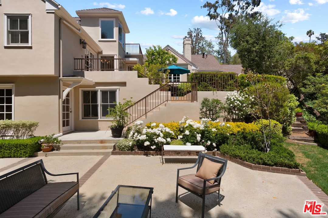 1020 Casiano Road Los Angeles, CA 90049 - Photo 28 of 31 a view of a patio with couches table and chairs and potted plants