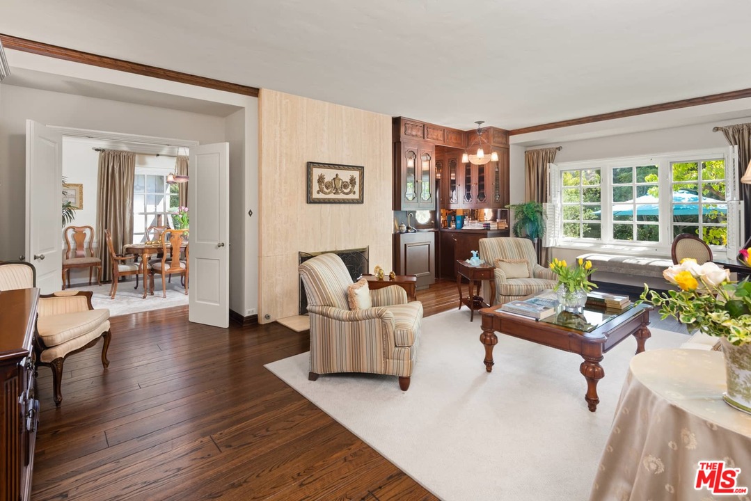 1020 Casiano Road Los Angeles, CA 90049 - Photo 6 of 31 a living room with furniture and a large window