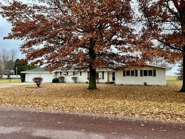 a house with trees in the background