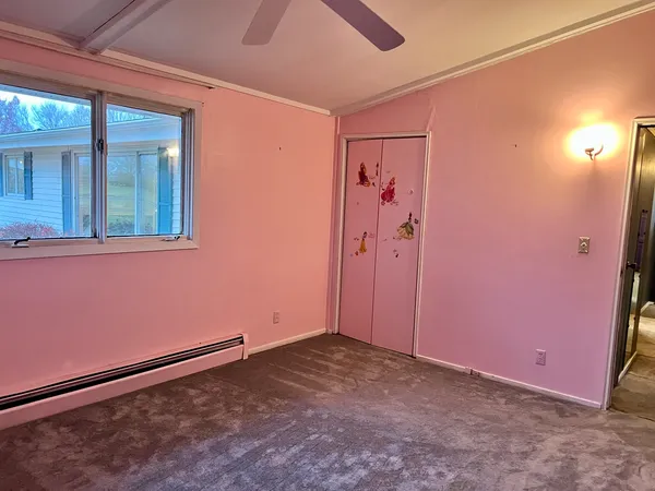 a view of a bathroom with a window and a shower