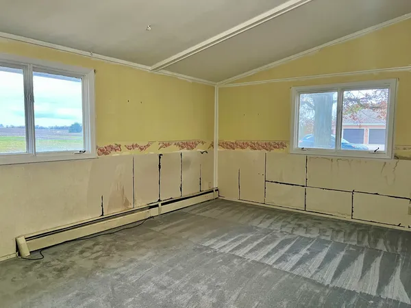 an empty room with windows