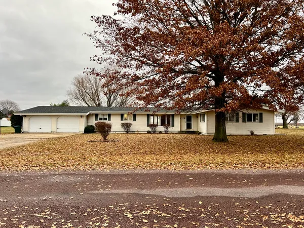 front view of a house with a trees