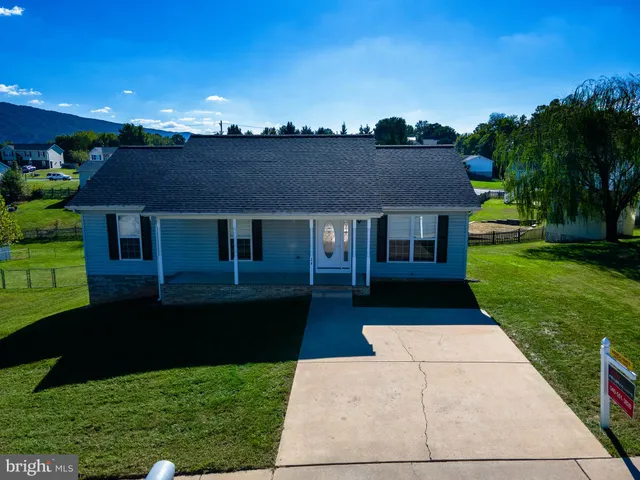 a aerial view of a house with a yard