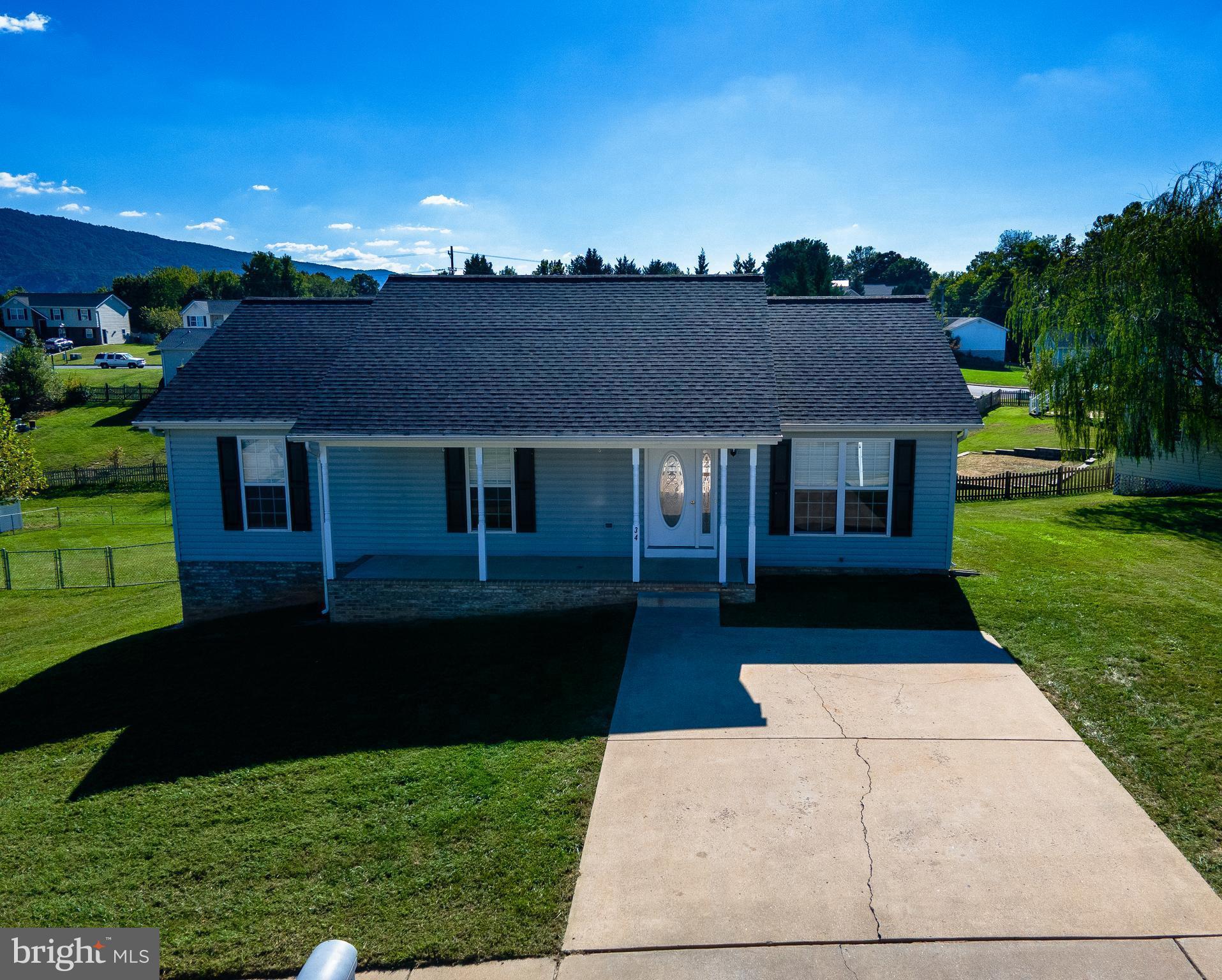 34 Stuart Court Strasburg, VA 22657 - Photo 12 of 54 a front view of a house with garden