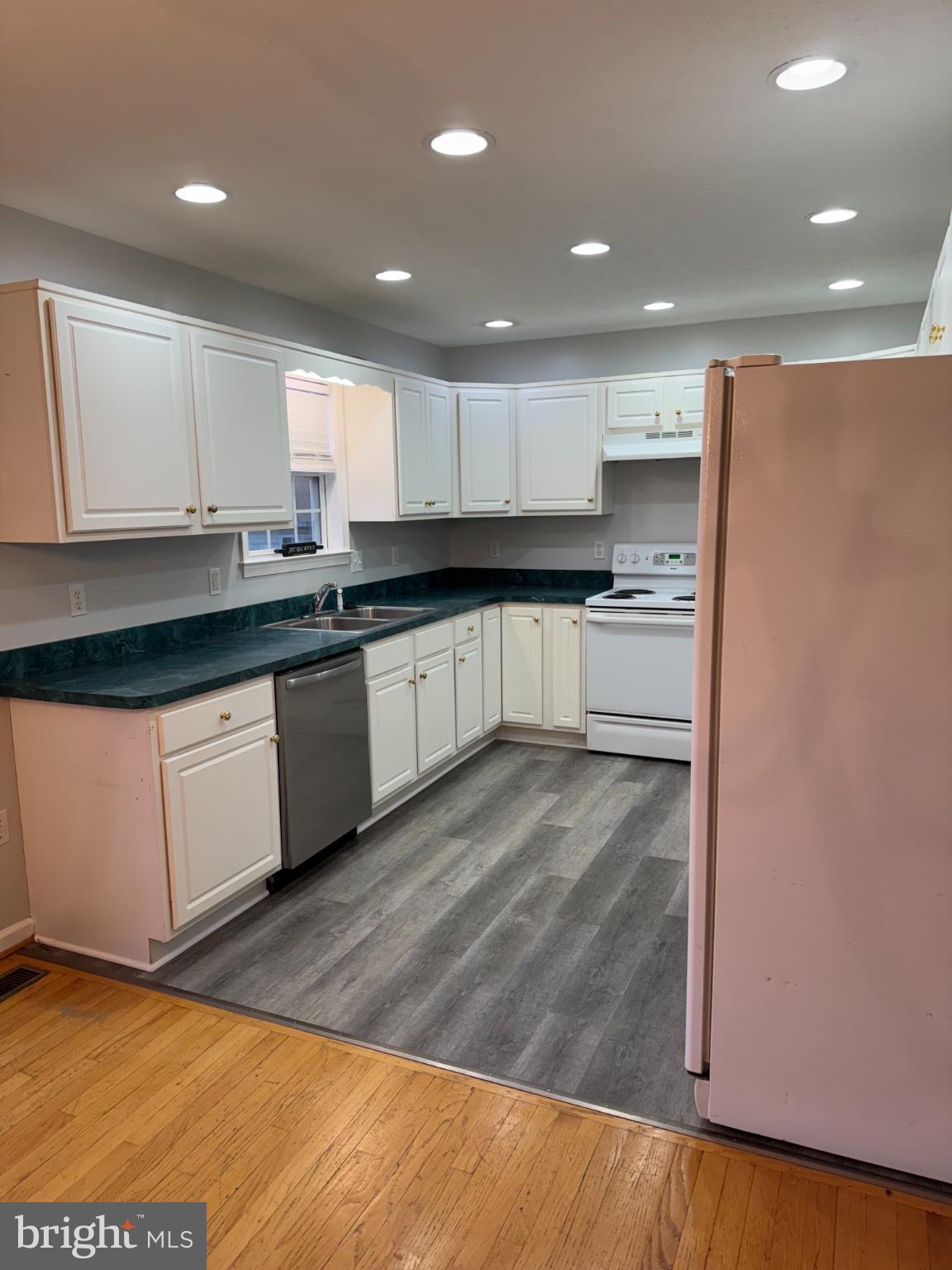 34 Stuart Court Strasburg, VA 22657 - Photo 16 of 54 a large kitchen with stainless steel appliances granite countertop a stove a sink and a refrigerator