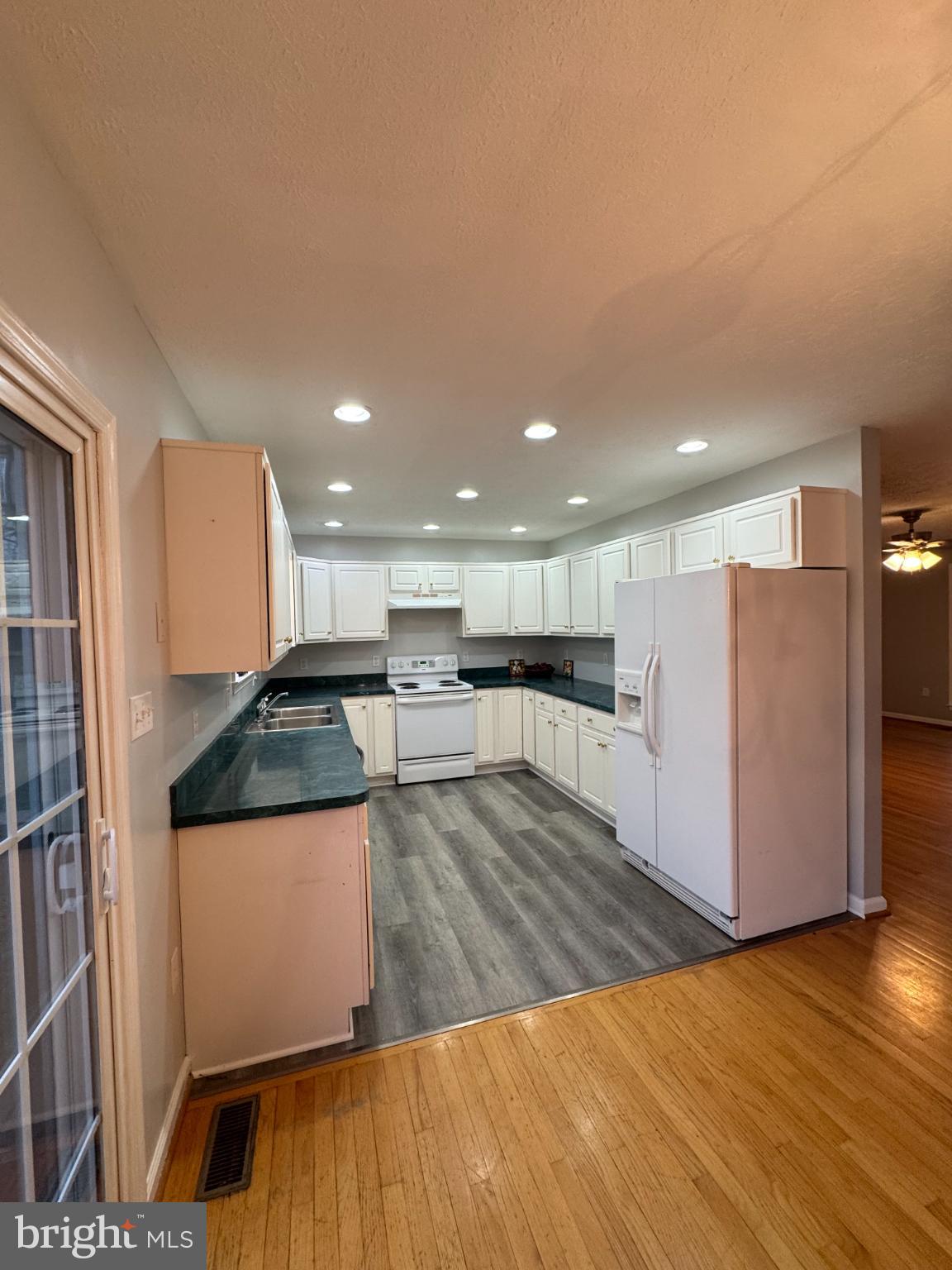 34 Stuart Court Strasburg, VA 22657 - Photo 17 of 54 a kitchen with stainless steel appliances granite countertop a refrigerator a stove and a wooden floors