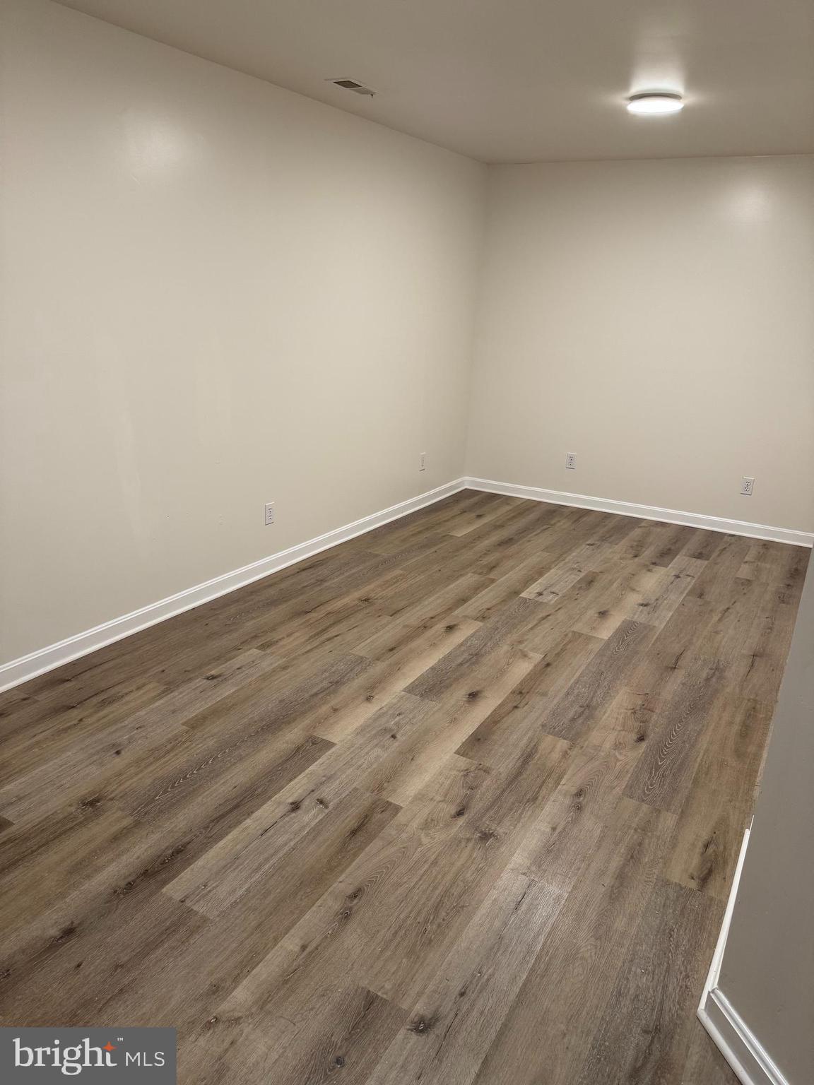 34 Stuart Court Strasburg, VA 22657 - Photo 23 of 54 an empty room with wooden floor