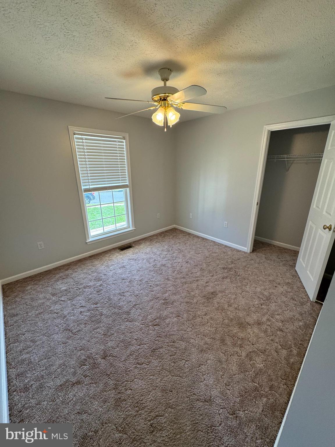 34 Stuart Court Strasburg, VA 22657 - Photo 29 of 54 an empty room with windows and fan