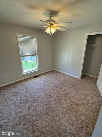 a view of a room with a wooden floor