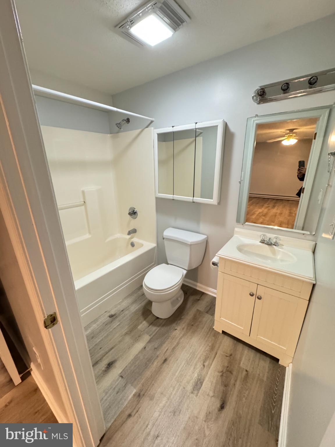 34 Stuart Court Strasburg, VA 22657 - Photo 43 of 54 a bathroom with a granite countertop sink toilet a mirror and shower
