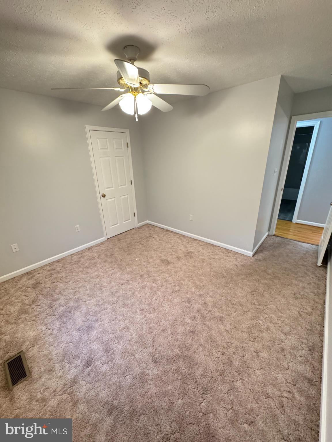 34 Stuart Court Strasburg, VA 22657 - Photo 45 of 54 a view of an empty room with wooden floor
