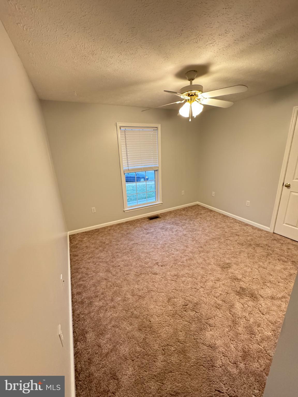 34 Stuart Court Strasburg, VA 22657 - Photo 54 of 54 an empty room with windows and fan