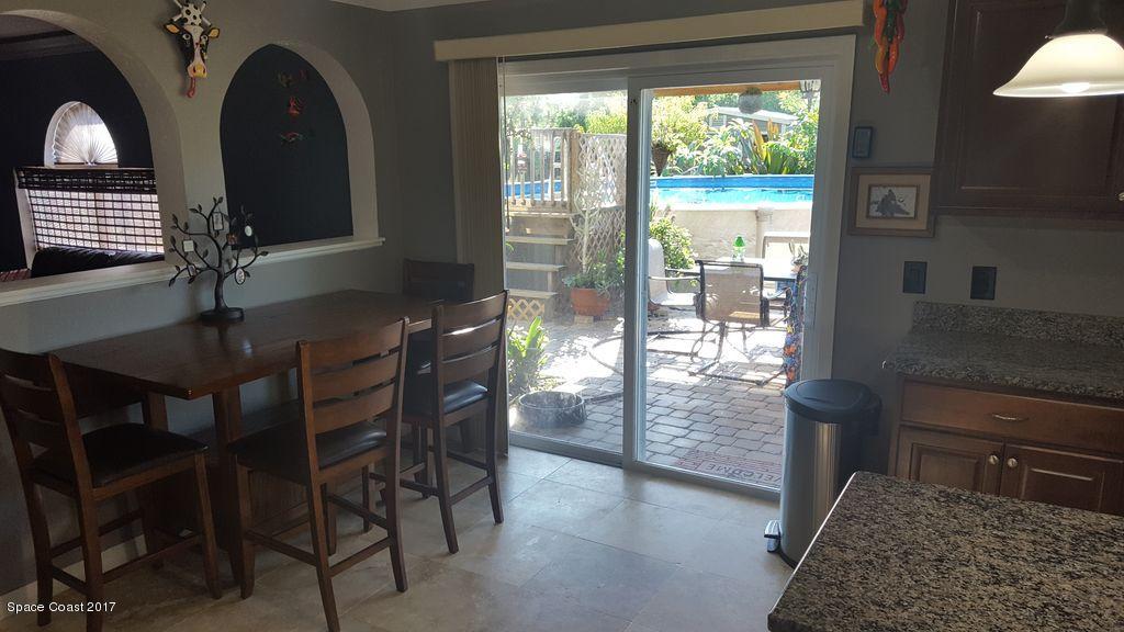 1667 Adview Road Southeast, Unit 50 Palm Bay, FL 32909 - Photo 9 of 26 Kitchen-Eat_in_ViewofPool