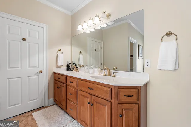 a large en suite bathroom with sink a bathtub and window