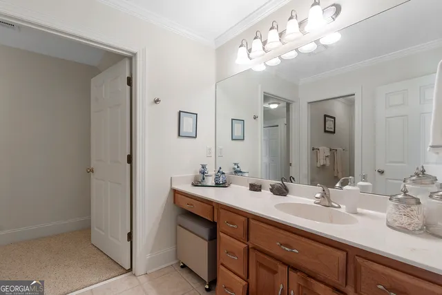a spacious bathroom with a sink double vanity and a mirror