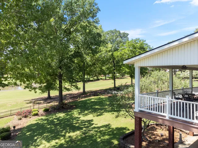 a view of a park with large trees