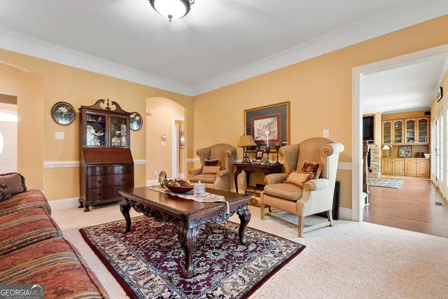 a living room with furniture and a rug