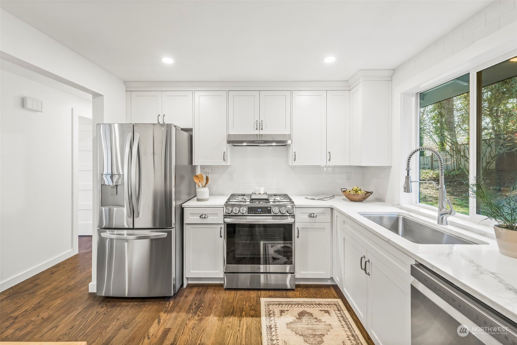 4008 66th Street Gig Harbor, WA 98335 - Photo 11 of 39 a kitchen with a stove a sink and a refrigerator
